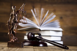 Wills Lawyer Farragut, TN with books, gavel, and lady justice statue on the desk of a 