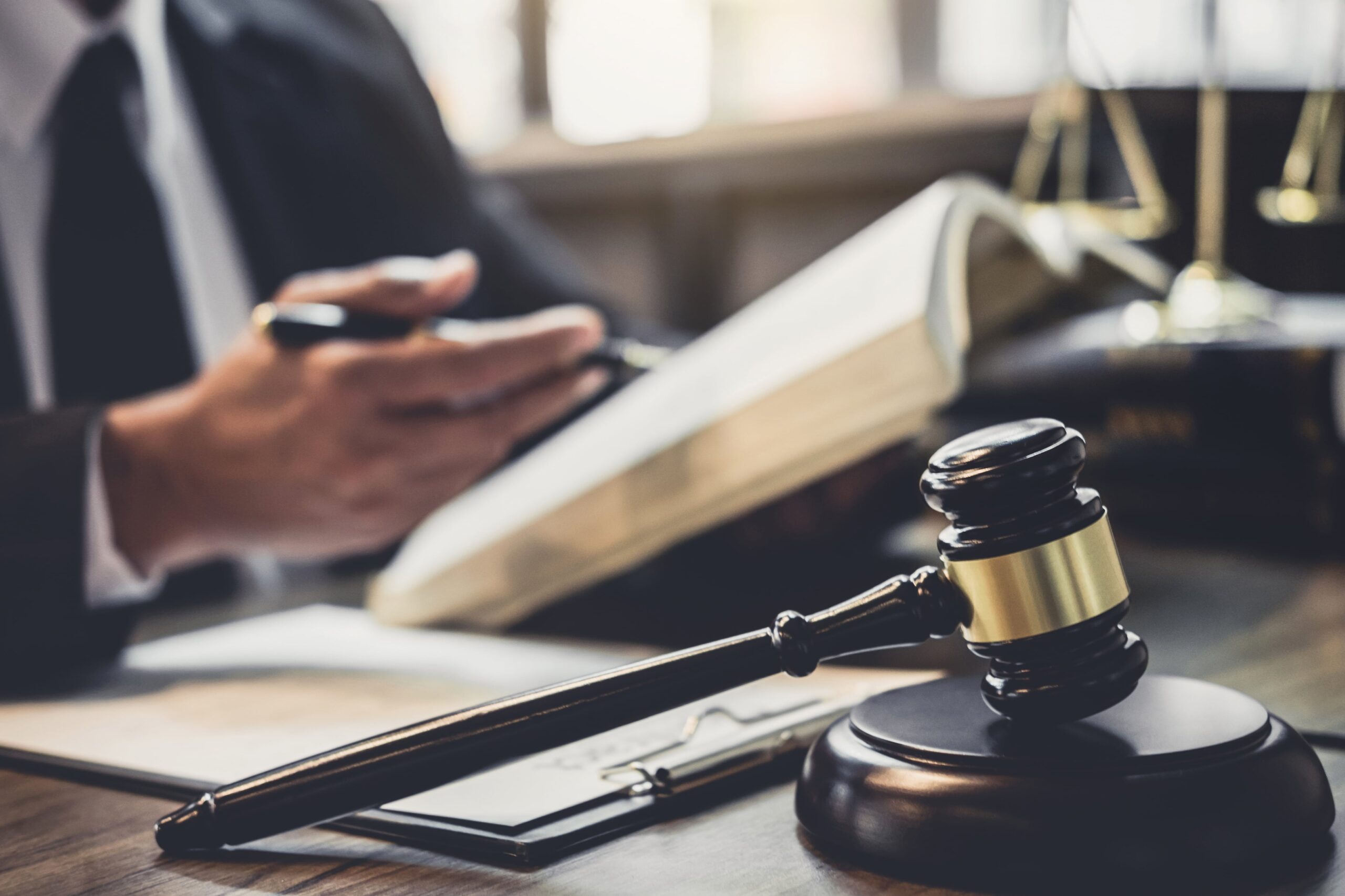 probate lawyer Farragut, TN with an attorney reading a book with a gavel in the foreground